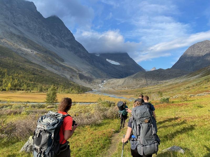 People walking in a valley.